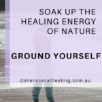 woman walking on the beach soaking up the healing energy of nature to ground herself