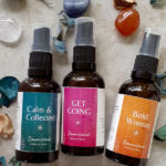 three bottles of aura sprays